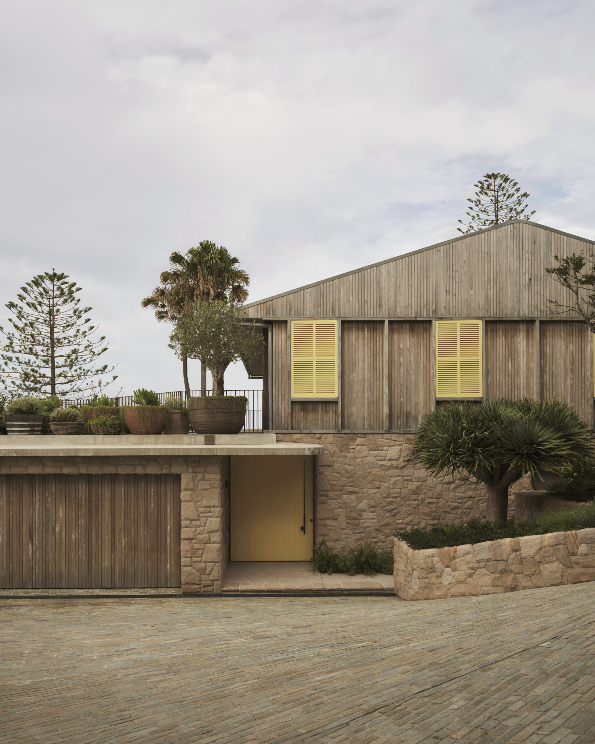 timber and sandstone clad house